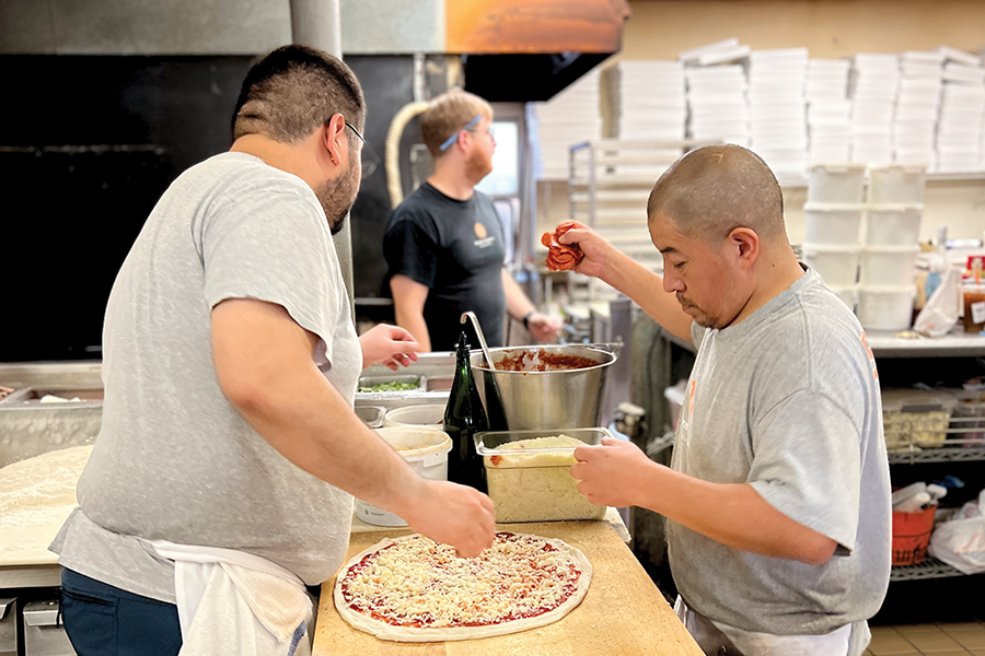 Modern apizza, pizza makers making a pizza on the makeline, new haven, connecticut, New Haven style pizza, apizza, 2023 Pizzeria of the Year